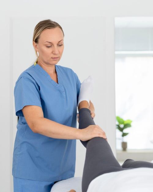 Physiotherapist Helping Patient
